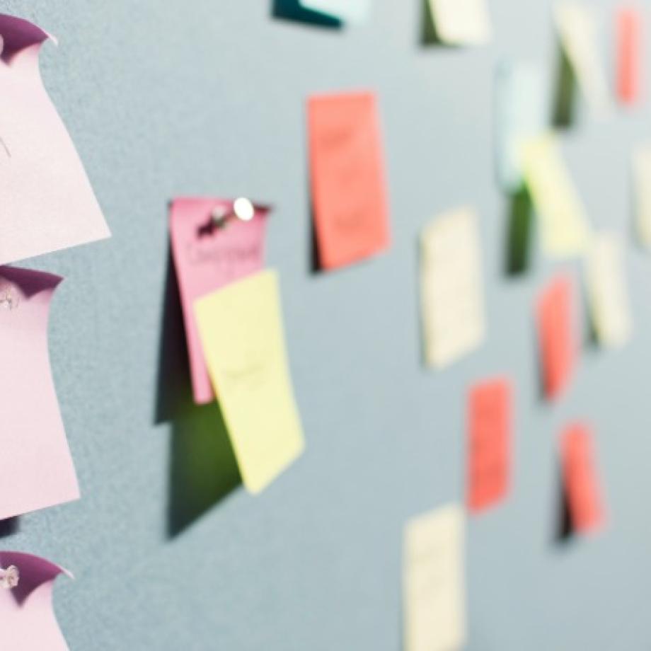 post-it notes tacked to an idea board